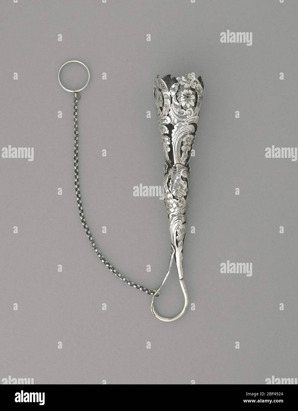 Bouquet holder engraved flowers. Silver funnel-type bouquet holder with ...