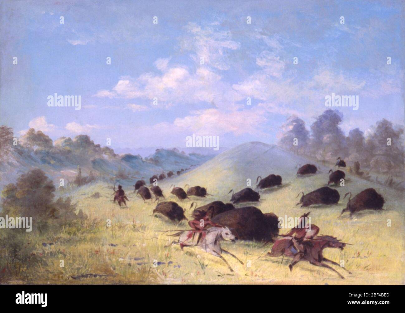 Comanche Indians Chasing Buffalo with Lances and Bows. George Catlin enjoyed and documented buffalo hunts with various tribes, describing methods such as the exhilarating but dangerous chase on horseback, the surround, and the ambush, in which hunters crept among the unsuspecting herds disguised under the skin of a white wolf for a c Stock Photo