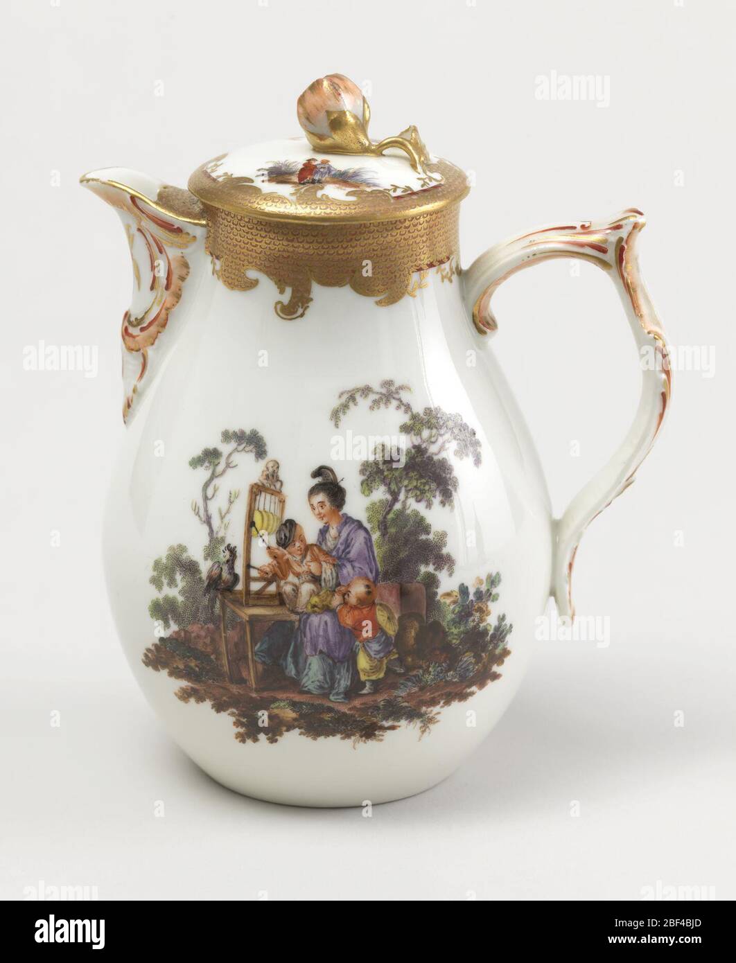 Covered Milk Jug with Chinoiserie Vignettes. Pear-shaped, bracket lip, double-curved strap handle. Small flat cover with flower finial. Vignettes of Chinoiserie figures in landscape, with gilded and painted imbricated borders. Stock Photo