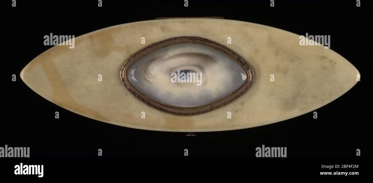 Eye Miniature on an Elliptical Ivory Box. Small paintings of eyes first became popular during the late eighteenth century. They reminded wearers of a loved one, whose identity remained a secret. The single eye also symbolized the watchful gaze of a jealous partner, who feared that his or her lover might stray. Stock Photo