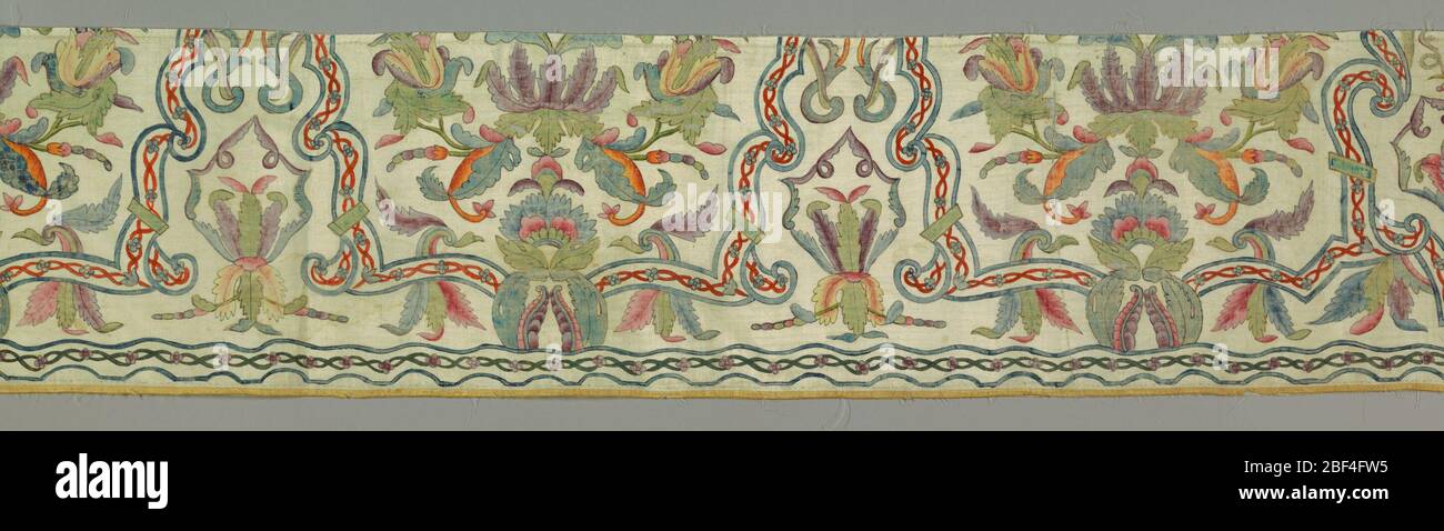 Fragment. Panel with several repeats of a conventionalized design made from leaves and flowers, arabesques and curving, intersecting lines. Stock Photo