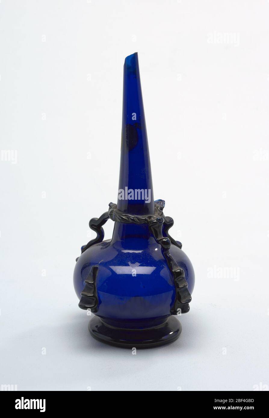 Vase. Cobalt blue glass ; long narrow neck with broken tip Stock Photo