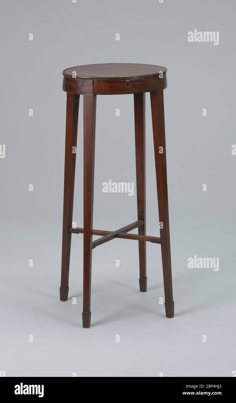 Urn stand. Oval top edged with brass strip inlaid; rectangular slide with  small brass handles. Square tapering legs splayed outward, ending in spade  feet joined by X-frame stretchers Stock Photo - Alamy