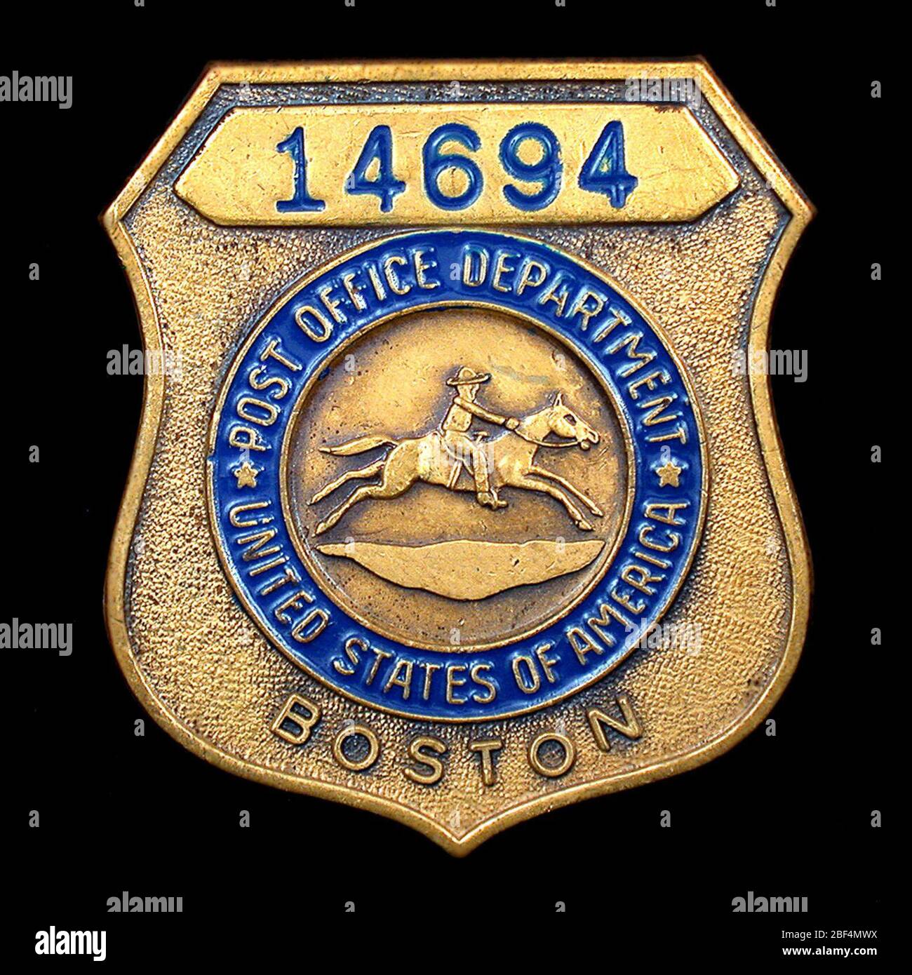 postal-clerk-chest-badge-number-14694-us-post-office-department-clerk-badge-number-14694-with-horizontal-hinged-pin-and-safety-clasp-on-verso-shield-design-with-horse-and-rider-medallion-numerical-figures-on-raised-upper-banner-lower-portion-inscribed-boston-2BF4MWX.jpg