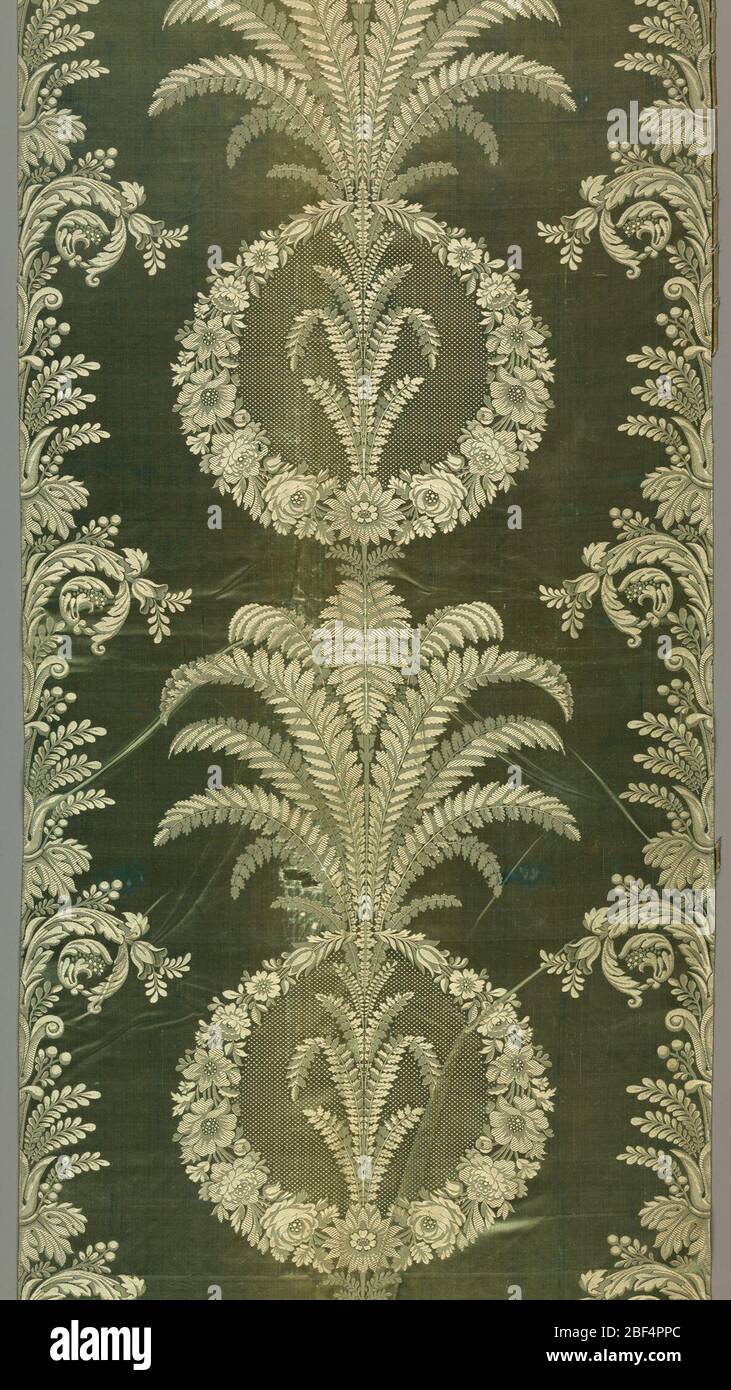 Textile. Circles of flowers, ferns and acanthus leaves in white and faded aqua. Stock Photo