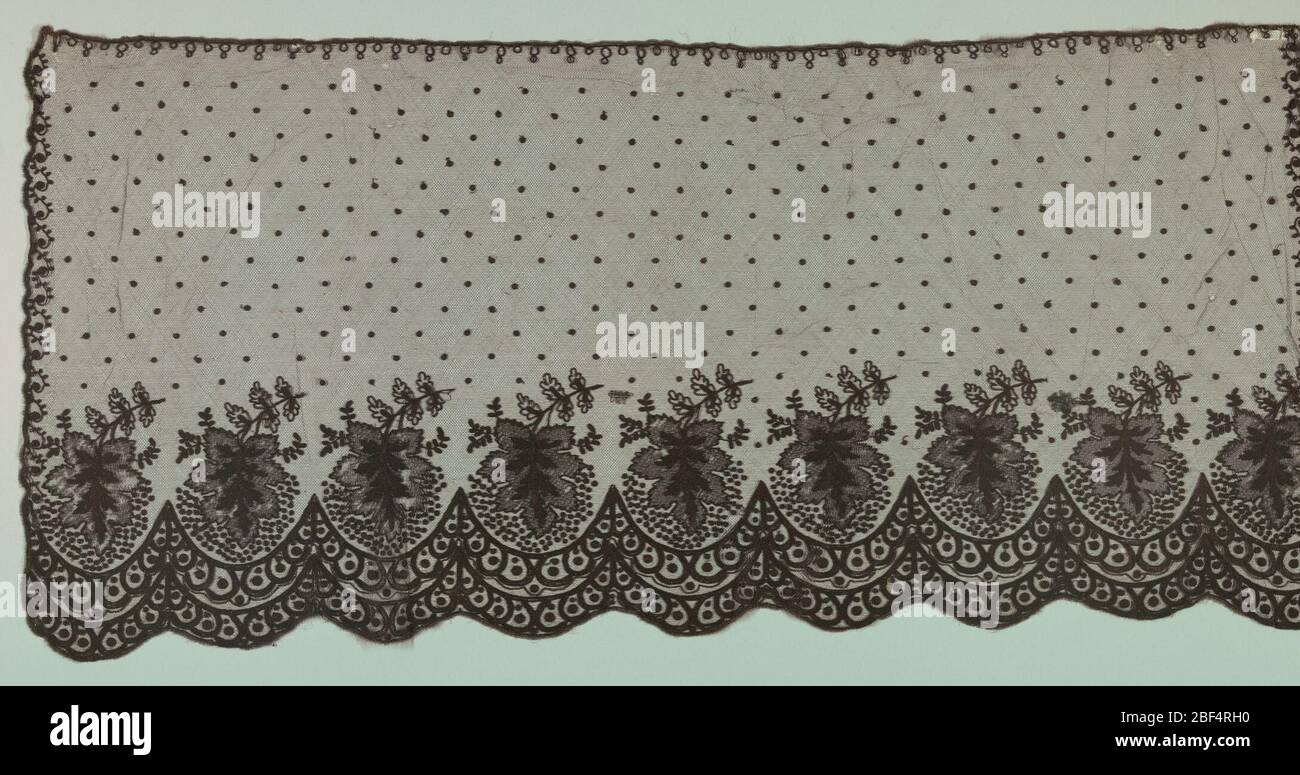 Bonnet veil. Repeating scalloped border with large leaf set into each scallop along the bottom edge. Motifs are embroidered in a chain stitch onto a net ground. Narrow scroll along remaining three edges and dotted field. Stock Photo