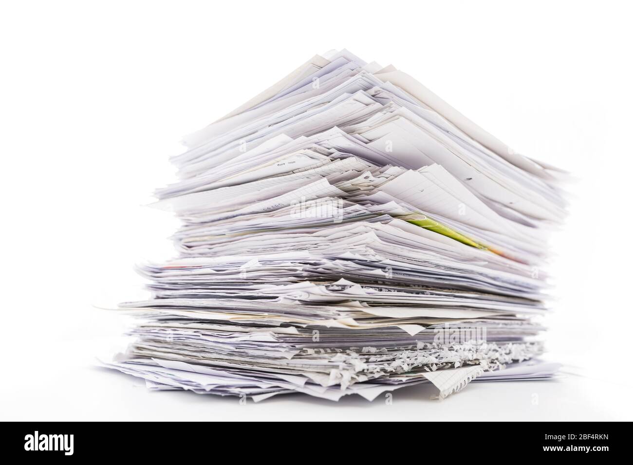 Large pile of waste paper isolated on white. Ready for recycling Stock Photo