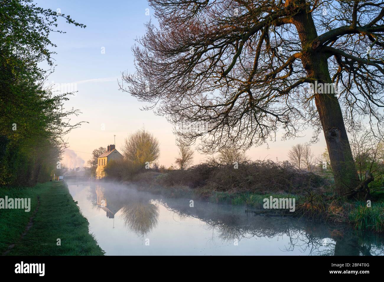 Derelict Lock Keepers cottage on the oxford canal on a spring morning at sunrise. Near Kings Sutton, Oxfordshire / Northamptonshire border, England Stock Photo
