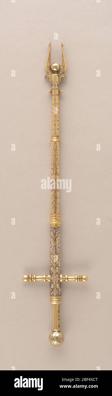 Cherry spear. Spring-loaded silver cherry spear with gilt, engraved and relief decoration. Stock Photo