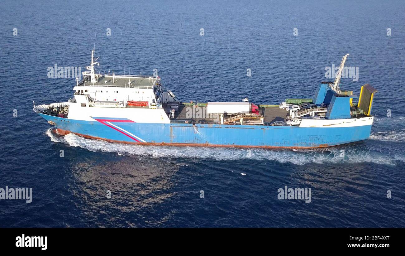 Ro Ro Ship: Aerial view of a medium RoRo Vehicle carrier vessel cruising at sea. Stock Photo