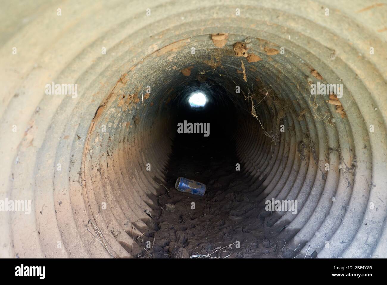 Inside view of Small culvert under a farm to market road in Texas Stock Photo