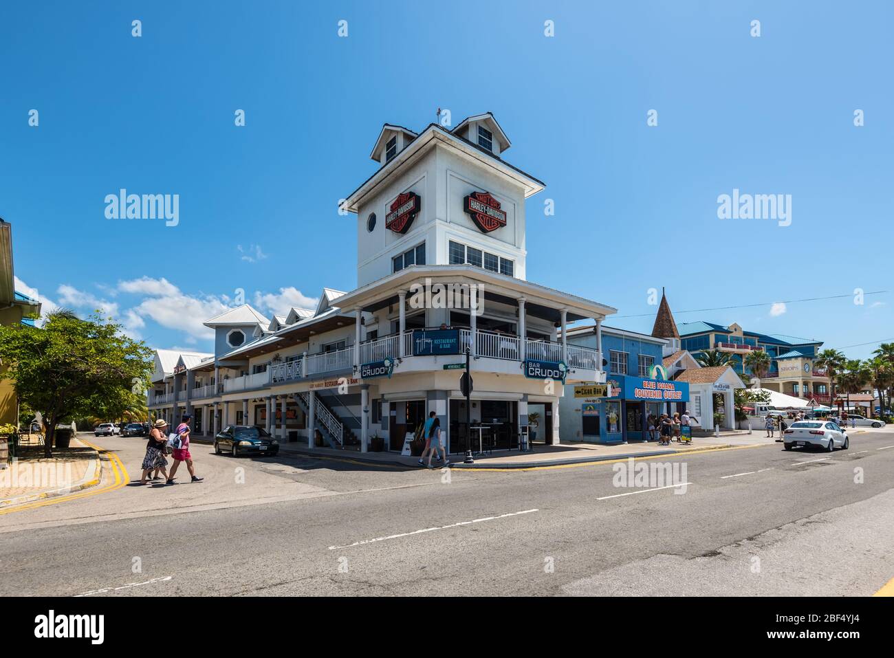 George Town, Grand Cayman Island, UK - April 23, 2019: Street view of George Town at day with pedestrians near cafes and tourist shops in downtown of Stock Photo