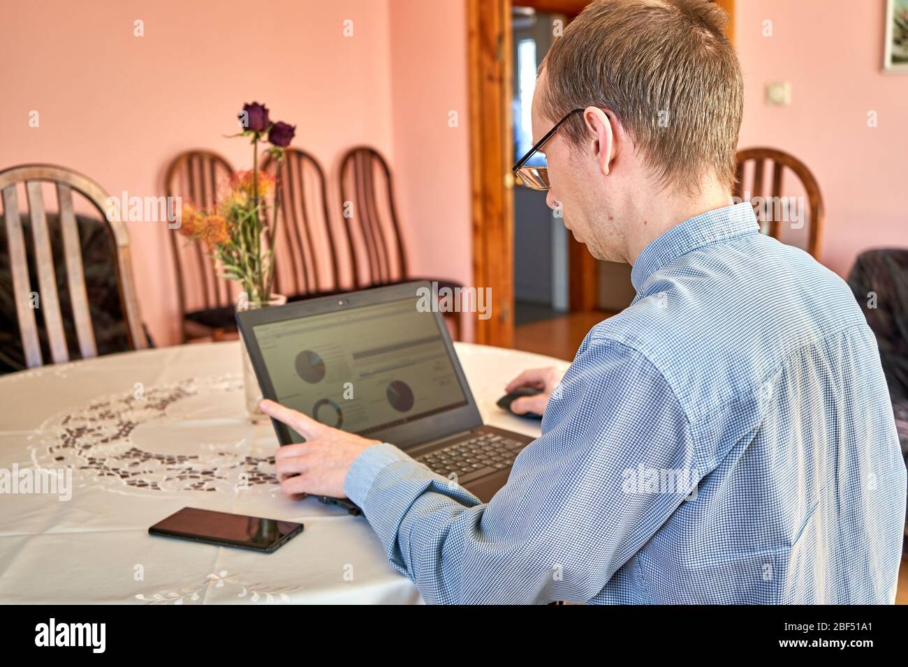 Businessman working with their laptop at home office. Stock Photo