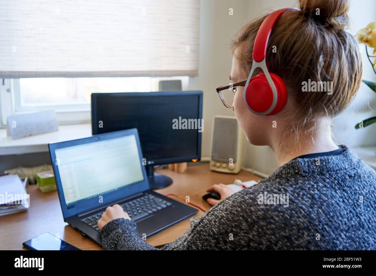 Young woman learning from home Stock Photo