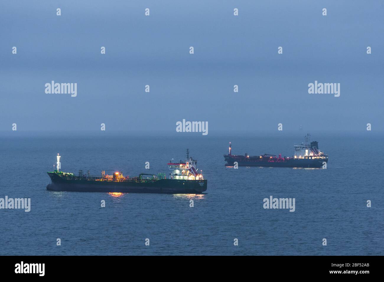 Fennells Bay, Cork, Ireland. 17th April, 2020. Tankers,  Thun Glory and Maingas lie at anchor off Fennells Bay, as they wait for their turn to discarge their cargo at the Whitegate Refinery in Aghada,  Co. Cork, Ireland. - Credit; David Creedon / Alamy Live News Stock Photo