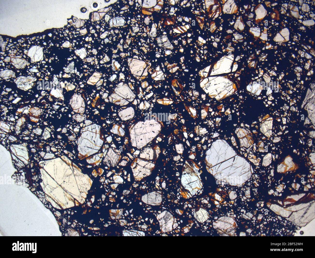 Micrograph of RKPA80229,2 meteorite under plane-polarized light at 1.25x magnification. Stock Photo