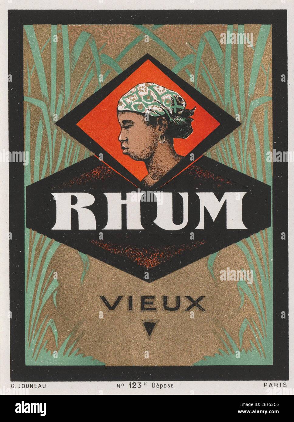 Vintage unused and rare label for Rhum (American: Rum of Jamaica) liquor. This label has an illustration of slavery, showing a black african slave bet Stock Photo