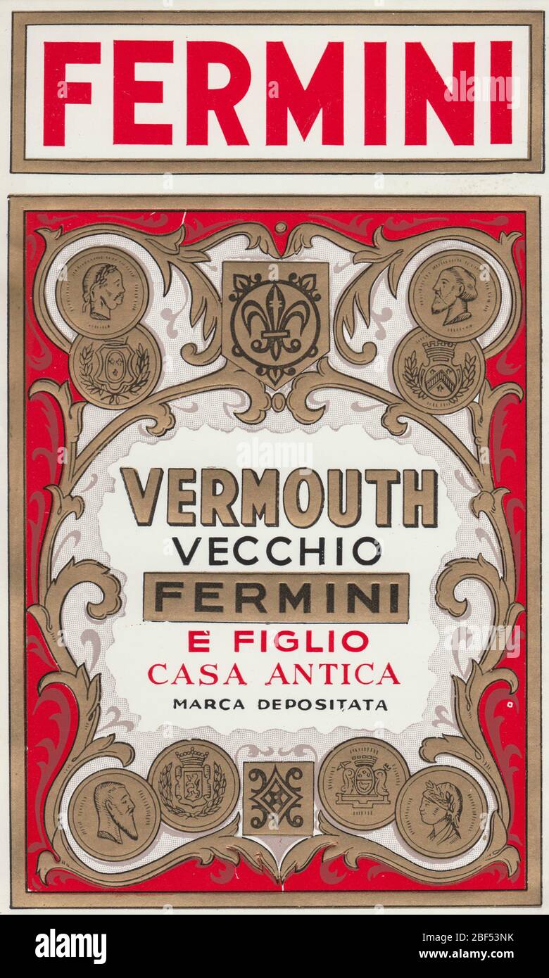Vintage rare unused label of Fermini Vermouth, showing golden deocrations on a red background. Vermouth is an aromatized, fortified wine flavored with Stock Photo