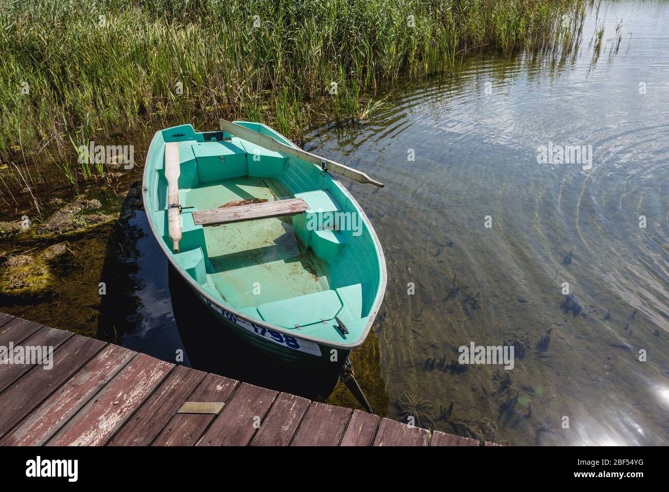 Small boat on a Wigry Lake in Rosochaty Rog village within Sejny County,  Podlaskie Voivodeship in northeastern part of Poland Stock Photo - Alamy