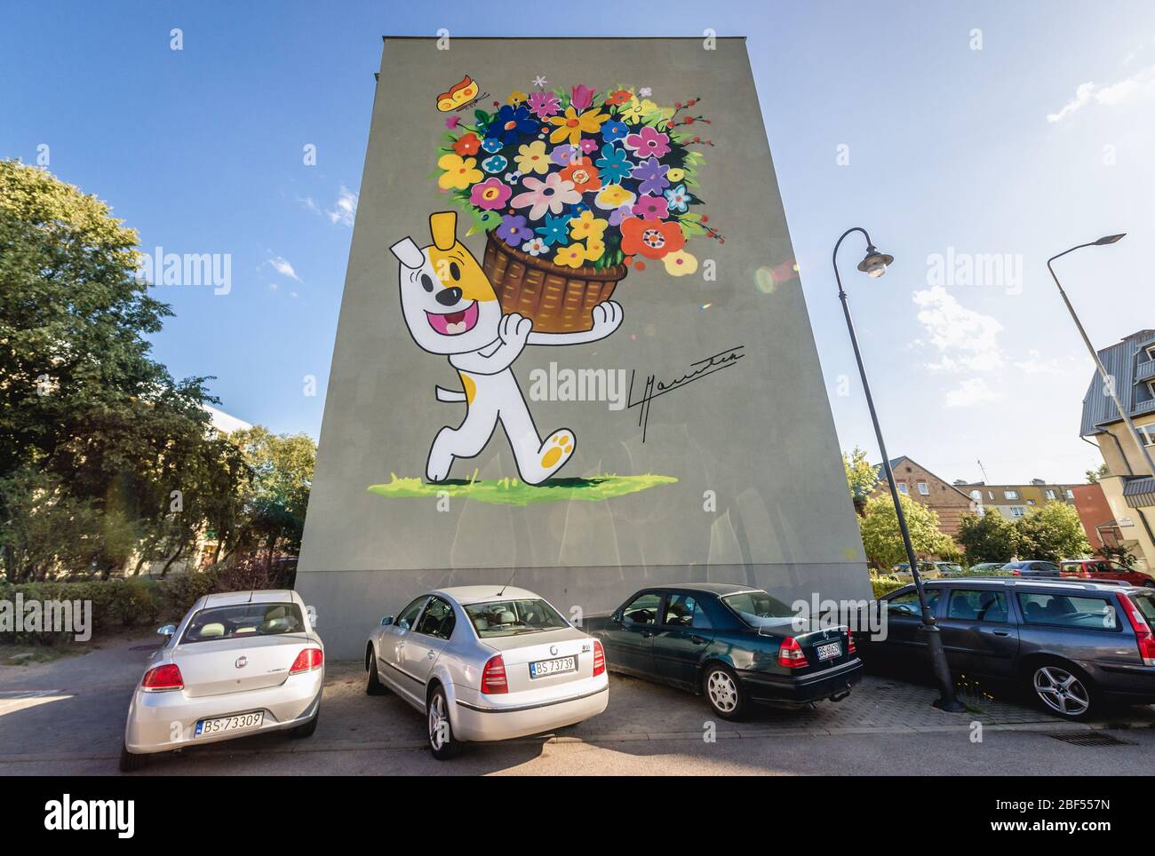 Reksio Polish cartoon character painting on a residential building wall in Suwalki city, located in Podlaskie Voivodeship of northeastern Poland Stock Photo