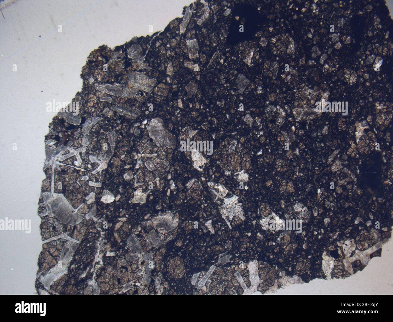 Micrograph of GRA 98158,2 meteorite under plane-polarized light at 1p25x magnification. Stock Photo