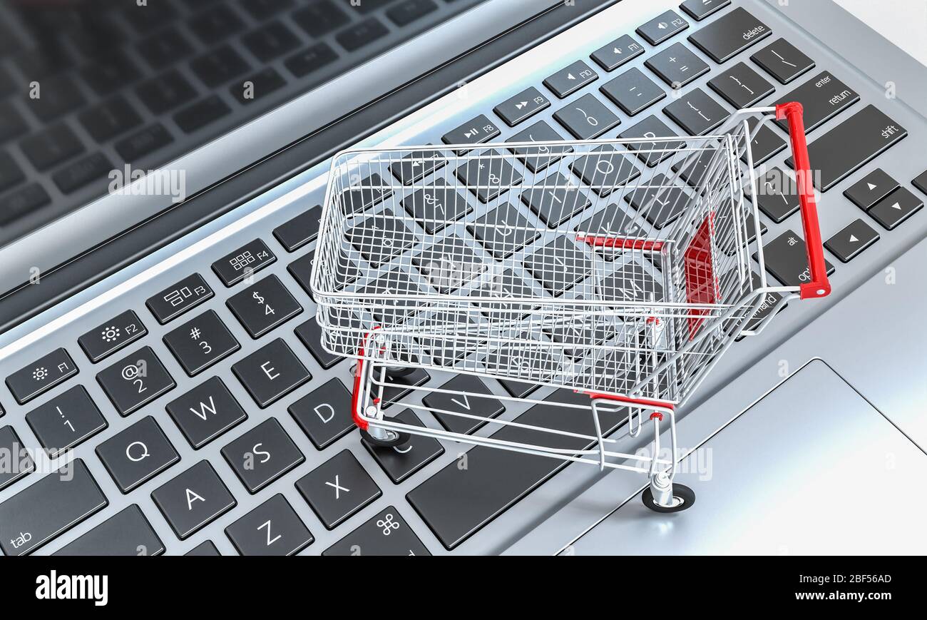 shopping cart on a notebook keyboard. online shopping and ecommerce concept. 3d render. nobody around Stock Photo