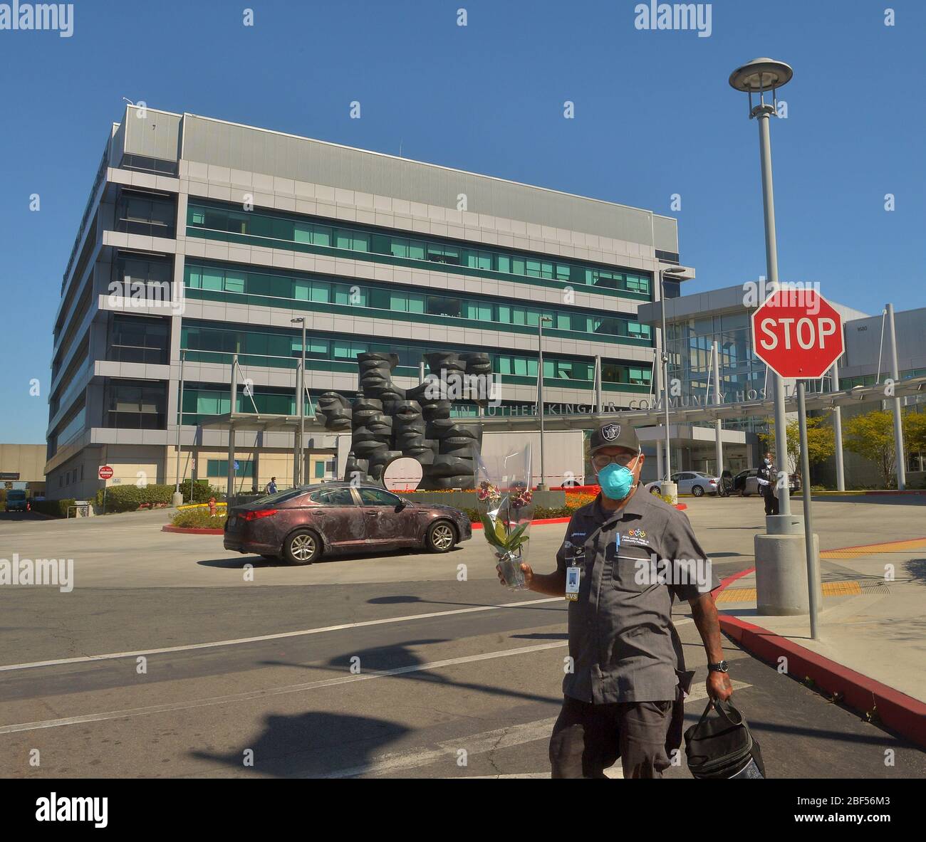 Los Angeles, United States. 17th Apr, 2020. A janitor walks to his car after finishing his shift at the Martin Luther King Jr. Community Hospital in Los Angeles on Thursday, April 15, 2020. Testing has fallen woefully short as President Trump seeks an end to stay-at-home orders. Flawed tests, scarce supplies and limited access to screening have hurt the U.S.'s ability to monitor COVID-19, governors and health officials warn. Photo by Jim Ruymen/UPI Credit: UPI/Alamy Live News Stock Photo