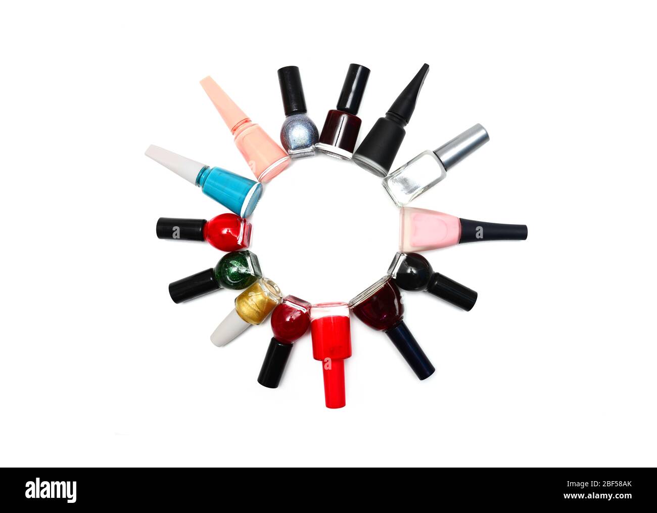 nail polish bottles in a circle over white Stock Photo Alamy