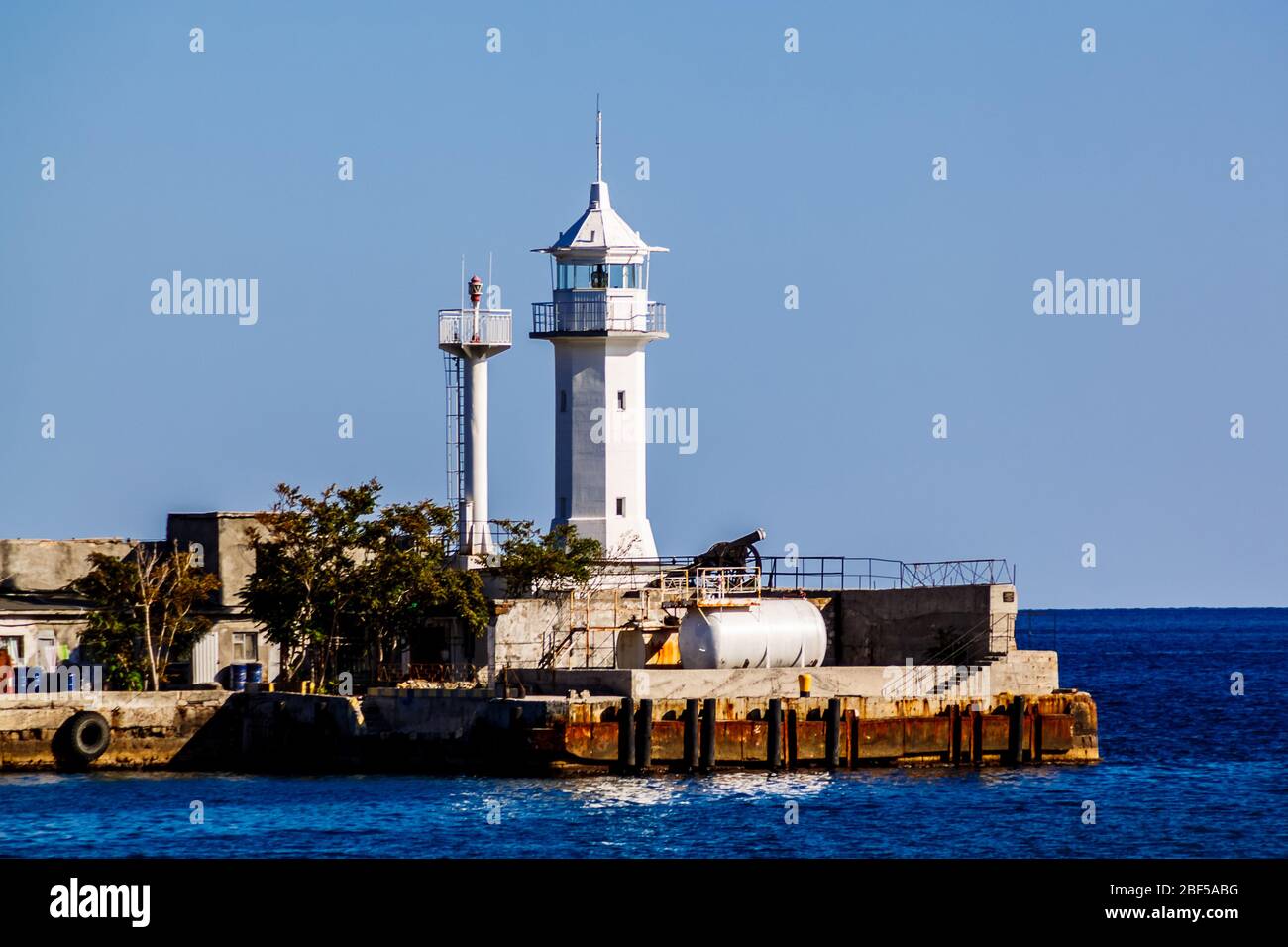 The lighthouse at the entrance to the Bay of Yalta. Crimea. Russia. Stock Photo