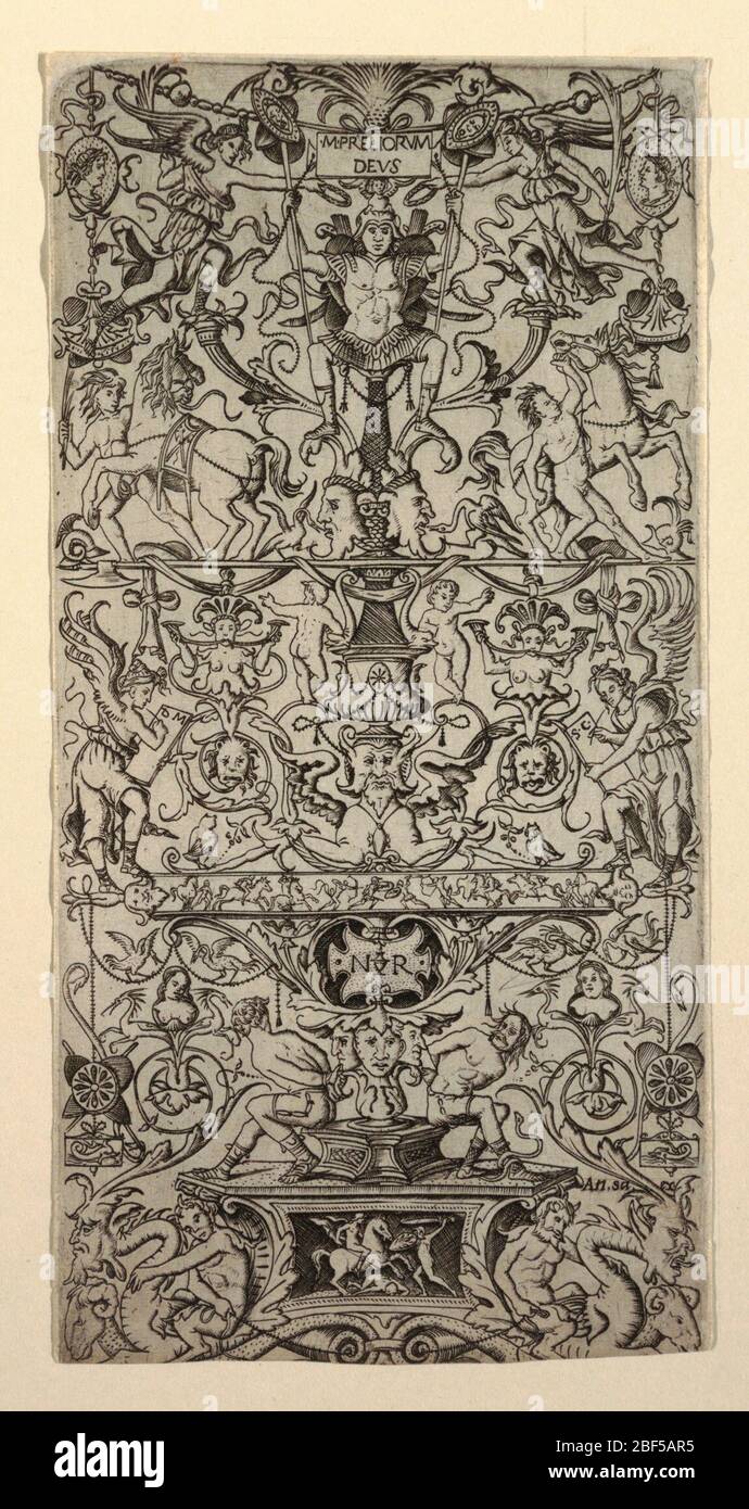 Ornament Panel with Mars. Vertical rectangle fully decorated with symmetrical grotesque. At top, cameo profiles and horses. Below, a small battle frieze and a pair of bound prisoners. Stock Photo