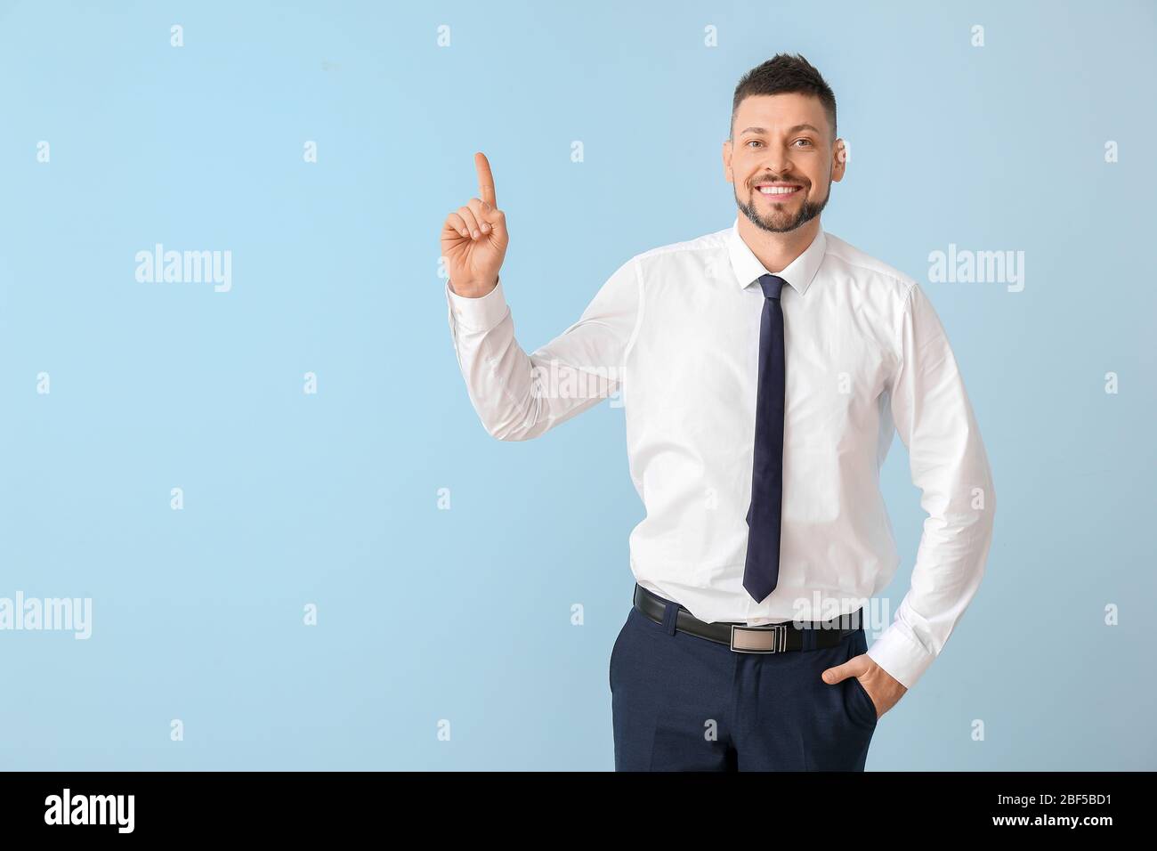Businessman man raised index finger hi-res stock photography and images ...