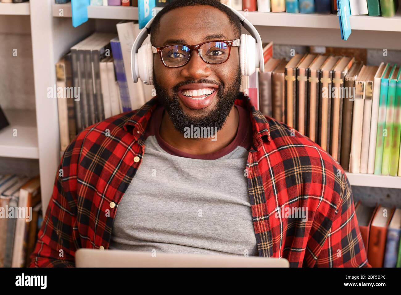 African-American student preparing for exam in library Stock Photo