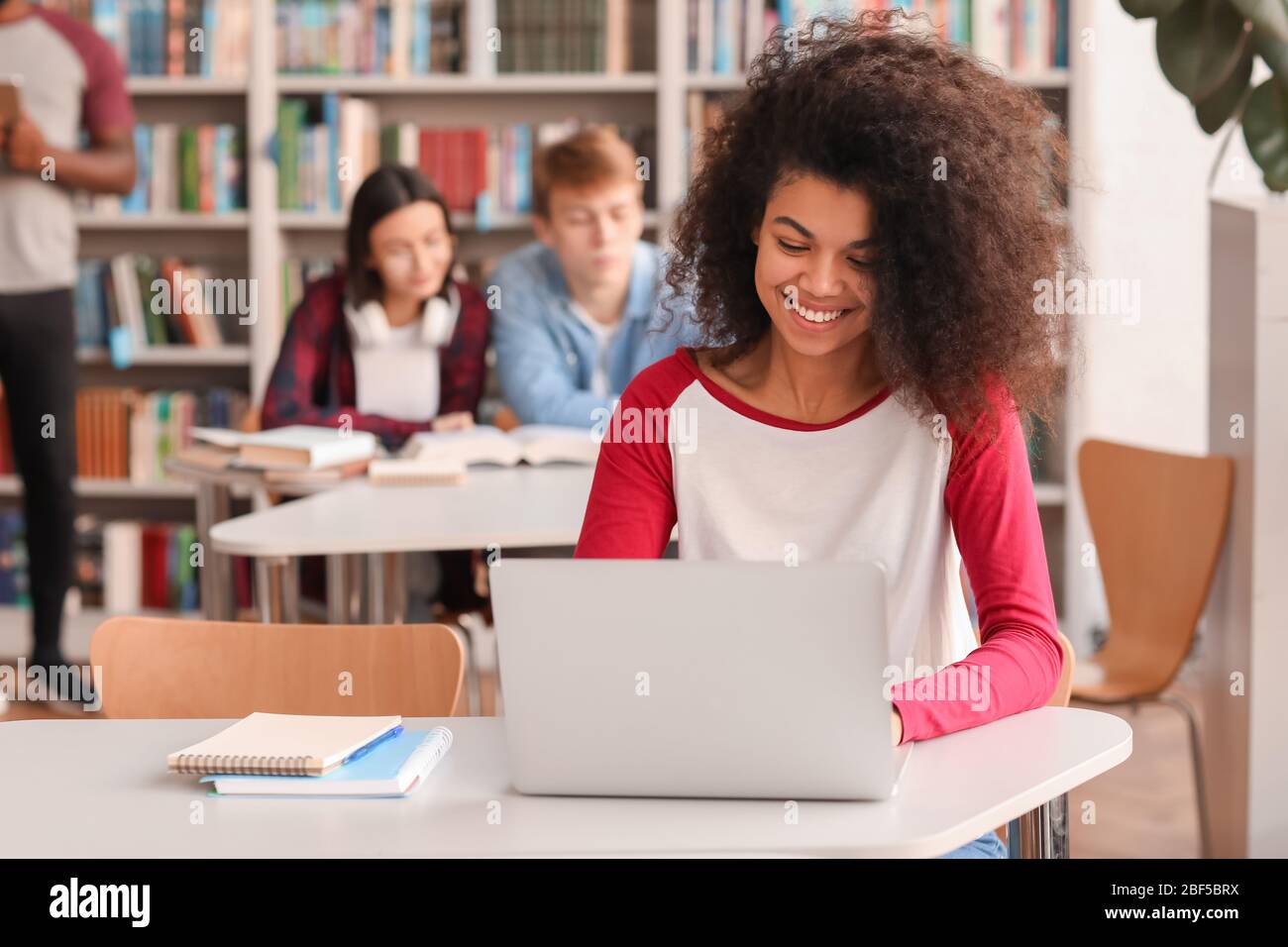 African-American student preparing for exam in library Stock Photo - Alamy