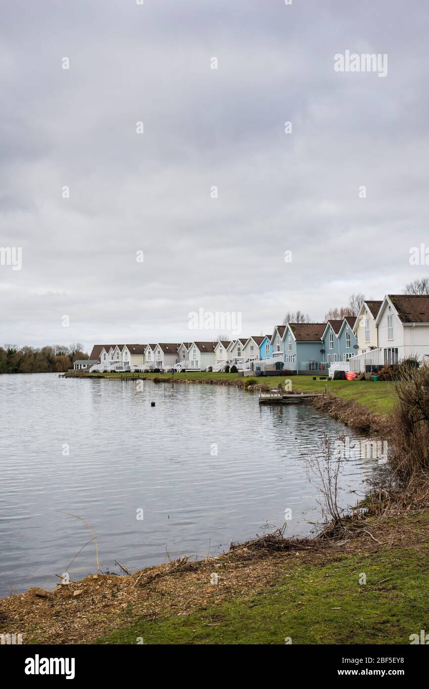 Lakeside houses by Spring Lake, South Cerney, Gloucestershire, UK Stock