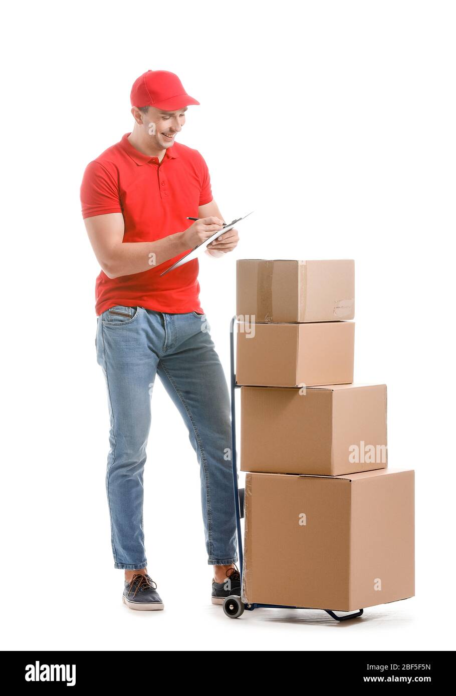 Delivery man with boxes on white background Stock Photo