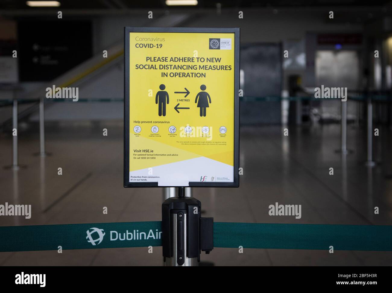 Dublin, Ireland - April 6, 2020: covid-19 public health information signage at Dublin Airport. Stock Photo
