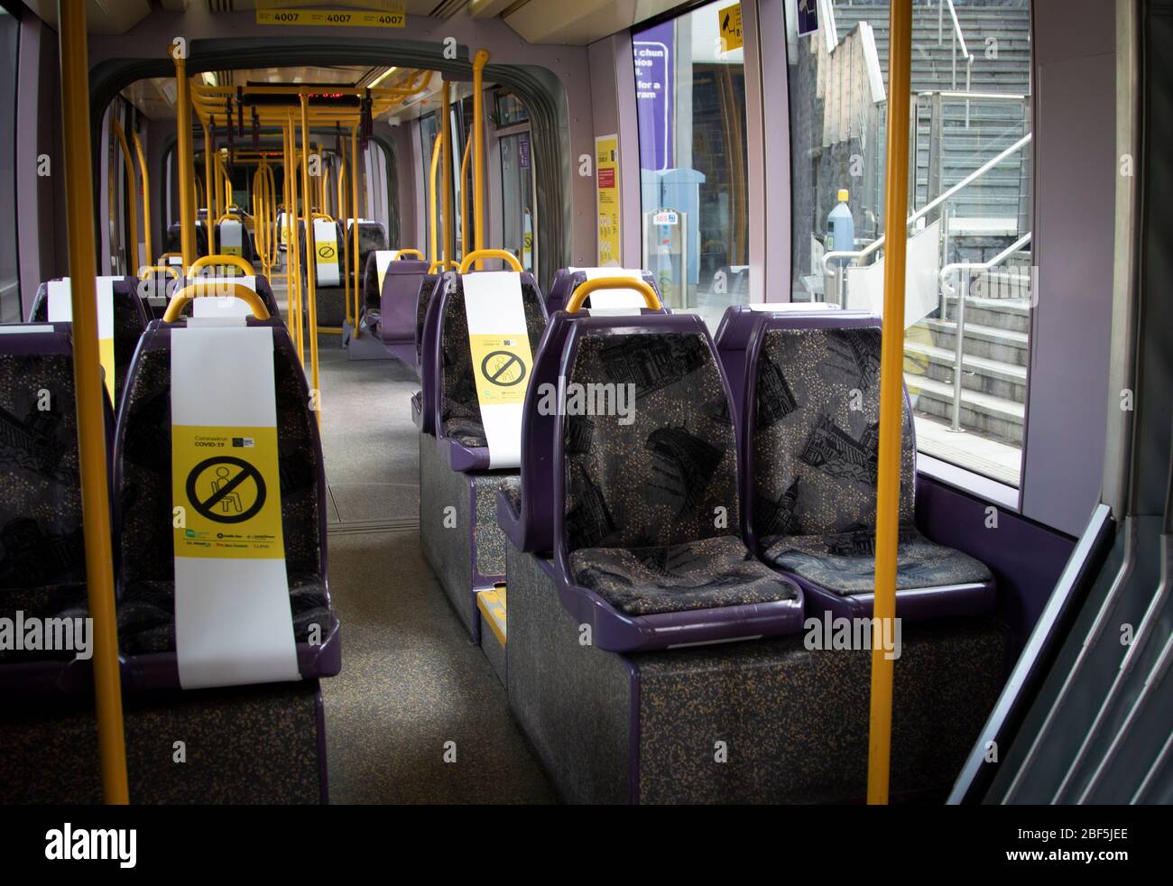 Dublin, Ireland - April 6, 2020: public health social distancing notices on a Luas tram during Covid-19 restrictions. Stock Photo