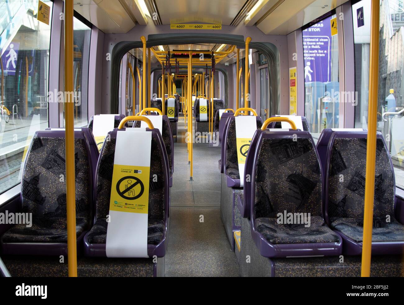 Dublin, Ireland - April 6, 2020: public health social distancing notices on a Luas tram during Covid-19 restrictions. Stock Photo