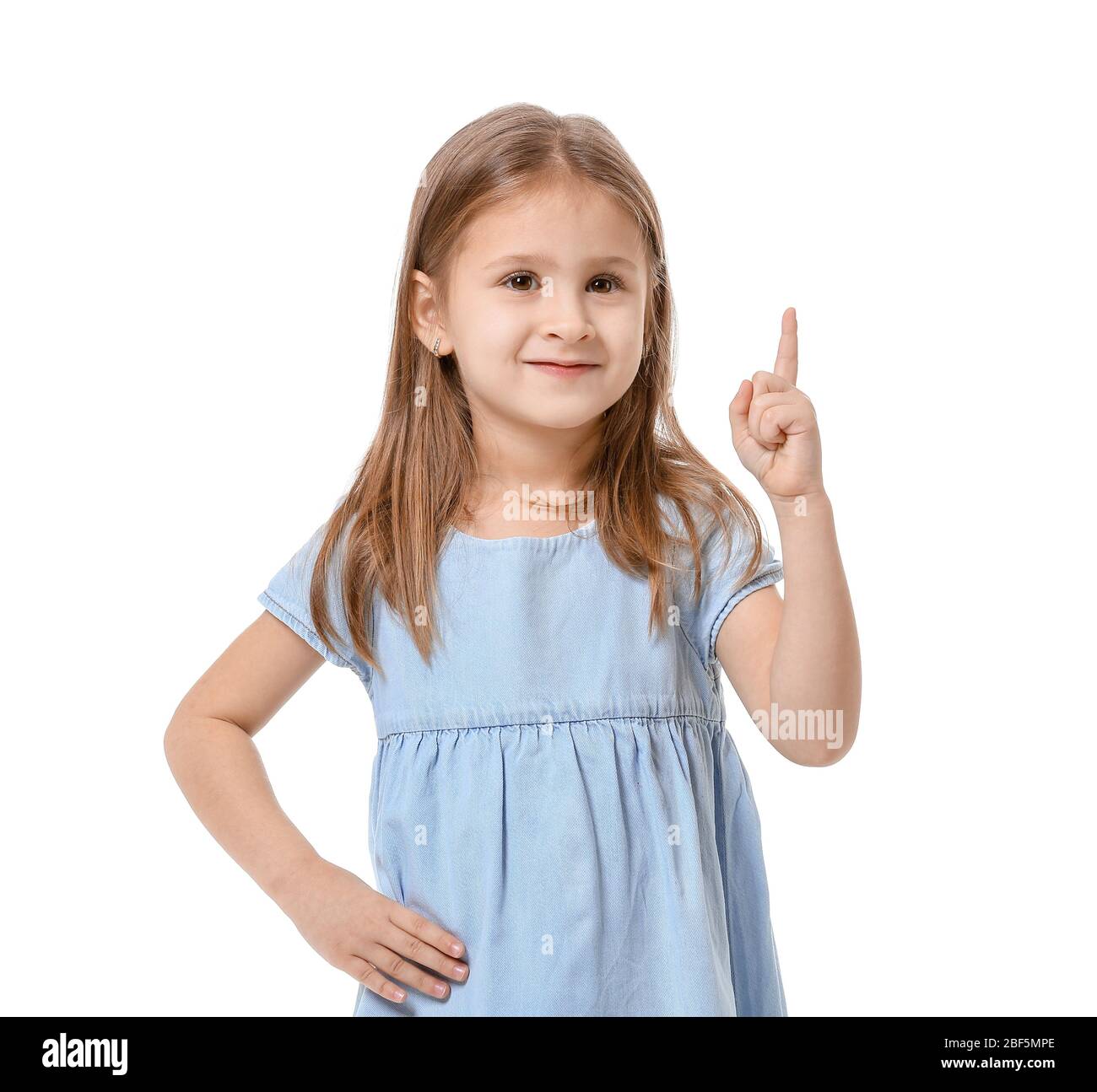 Cute little girl with raised index finger on white background Stock ...