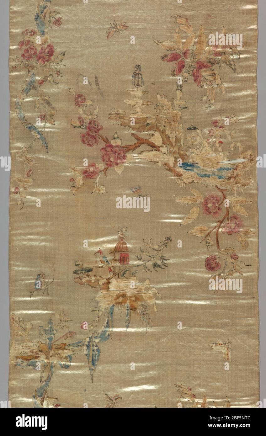 Textile. Cream-colored satin ground painted with Chinoiserie design of birds, pagodas, flowers and insects. Stock Photo