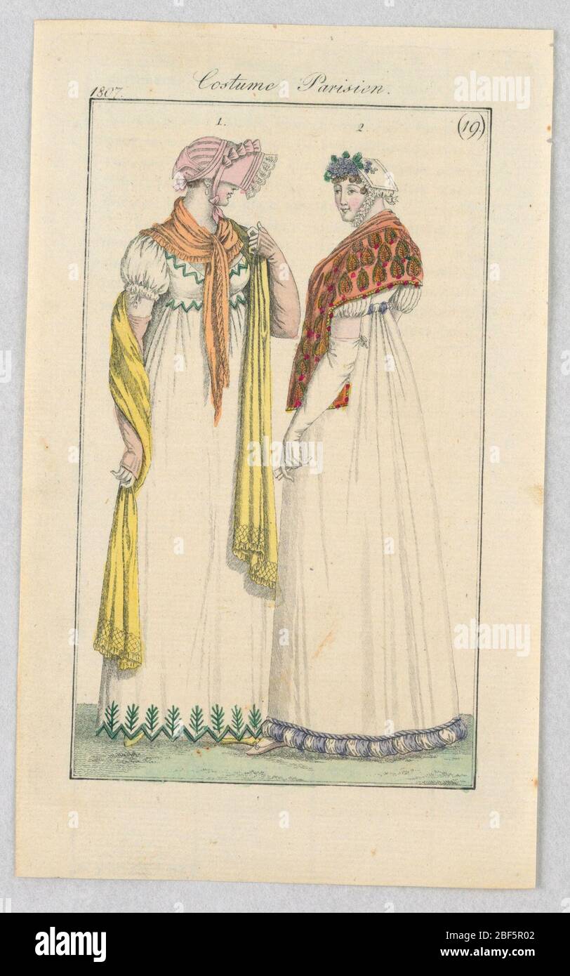 Plate 19 Costume Parisien Parisian Costume Journal des Dames et des Modes Journal of Ladies and Fashion. Fashion illustration featuring two women wearing long, white dresses. The woman on the right is partially turned around so that her back is visible to the viewer. Stock Photo