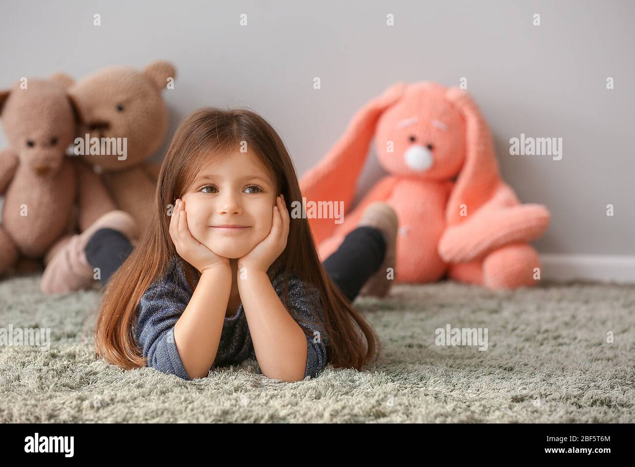 Portrait of cute little girl at home Stock Photo - Alamy