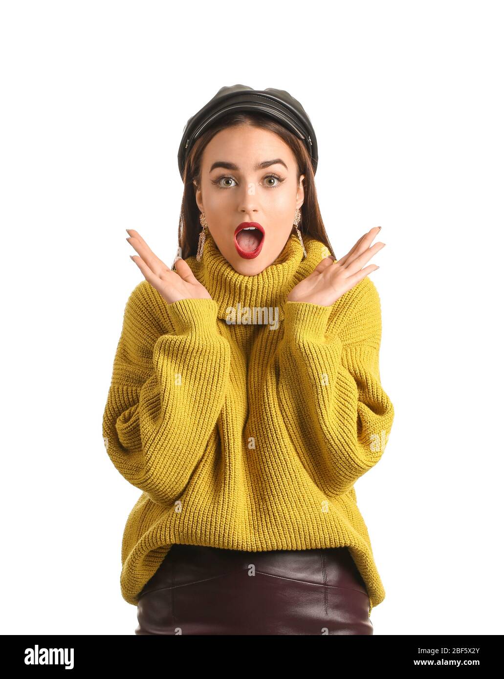 Surprised young woman on white background Stock Photo - Alamy