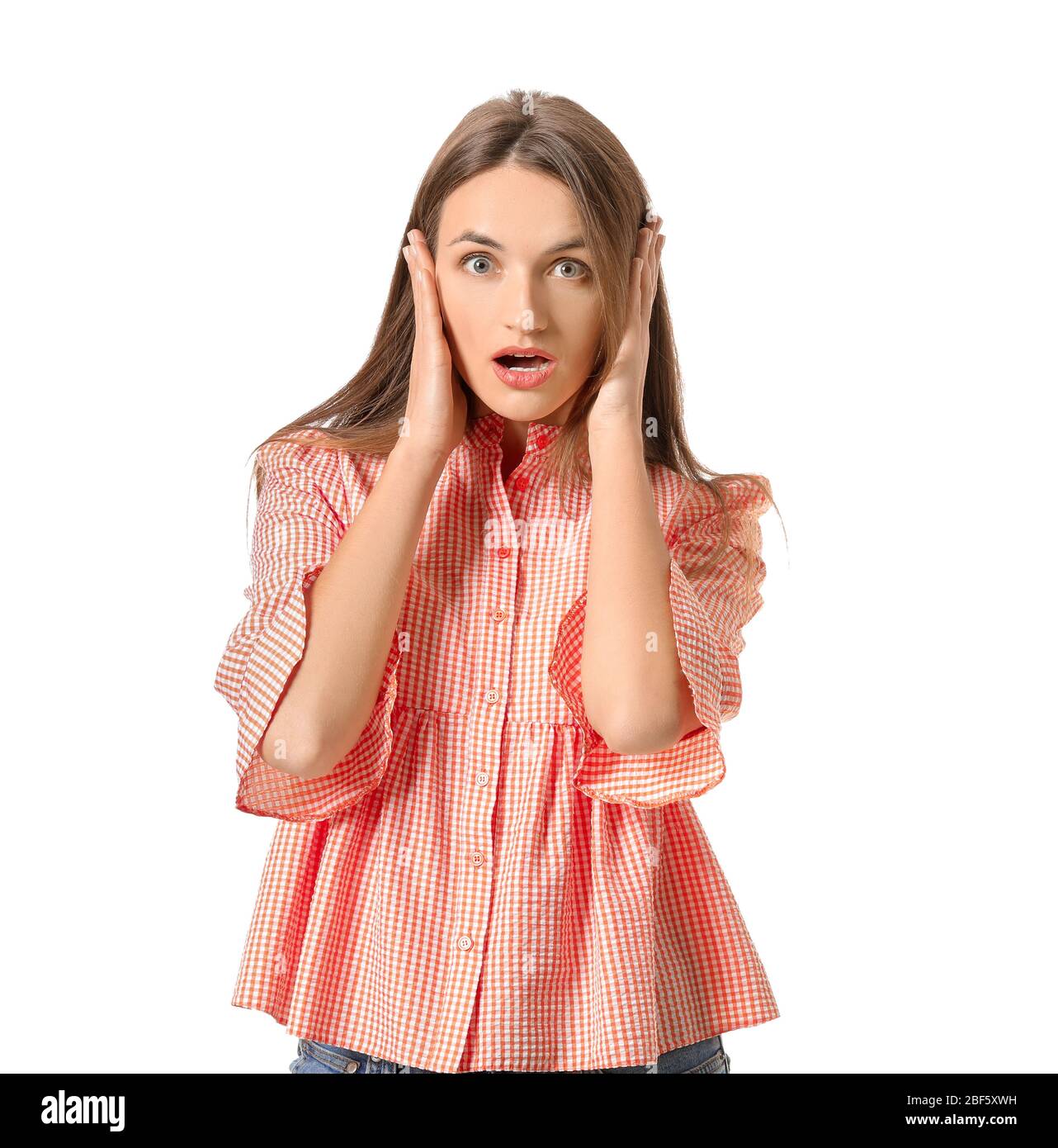 Surprised young woman on white background Stock Photo - Alamy