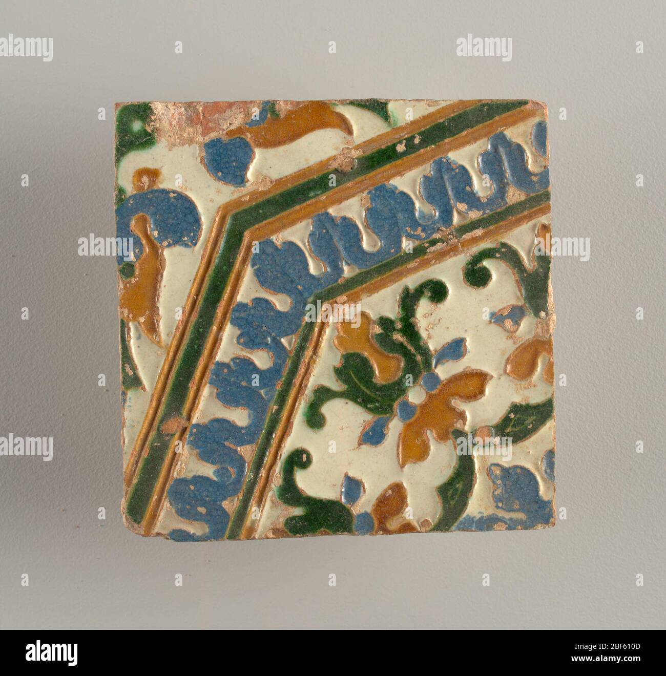 Octagonal Motif Four tiles. Moulded in low relief, with white, blue, green and brown ...