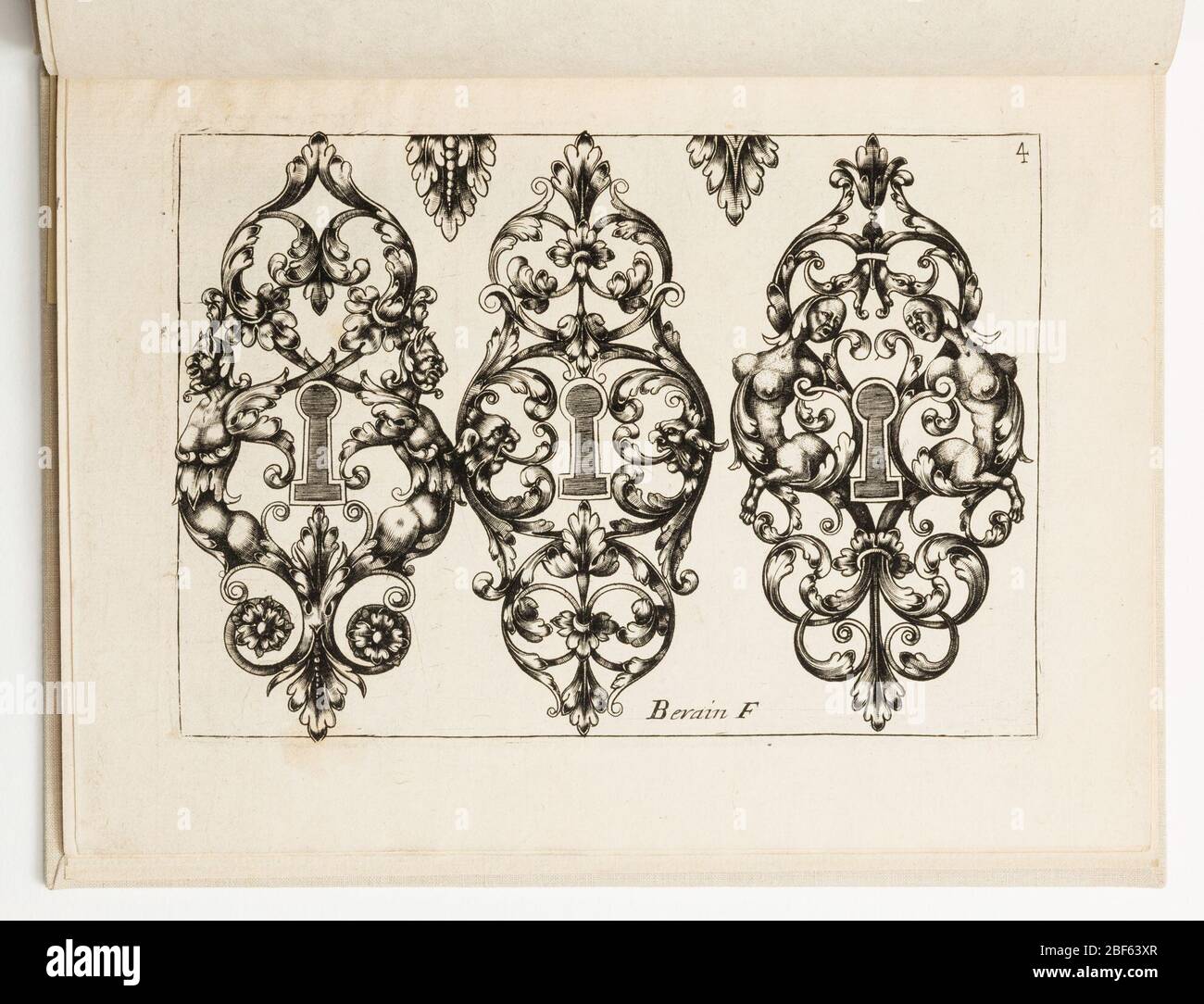 Plate 4 from Diverses pices de serruriers Various Designs for Locksmiths. Horizontal rectangle showing three escutcheon designs, each with interlacing leaves and opposing fantastic figures. Stock Photo