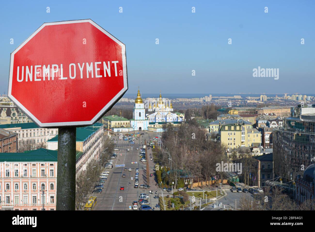 Unemployment sign on Kyiv view background. Financial crash in world economy because of coronavirus. Global economic crisis, recession Stock Photo