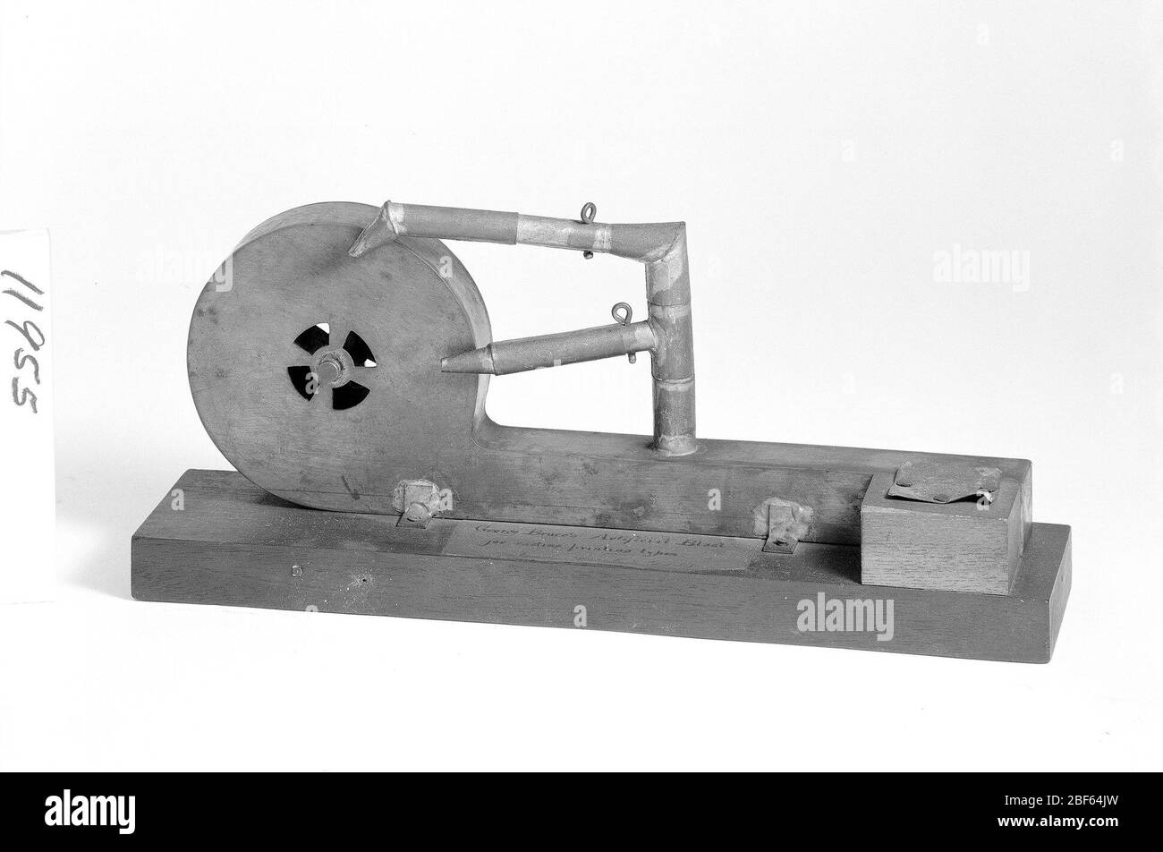 Patent Model for an Artificial Blast for Typecasting Machines. This patent model demonstrates an invention for an artificial blast for typecasting machines; the invention was granted patent number 11955. This device was intended for small type molds, which were apt to overheat at fast casting rates. Stock Photo