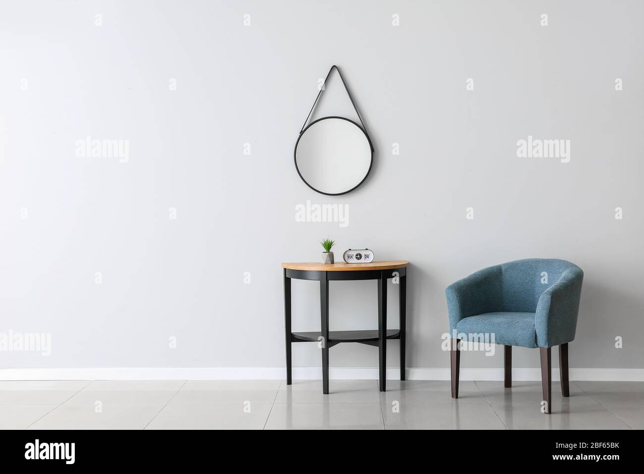 Interior of room with modern comfortable armchair and table Stock Photo ...