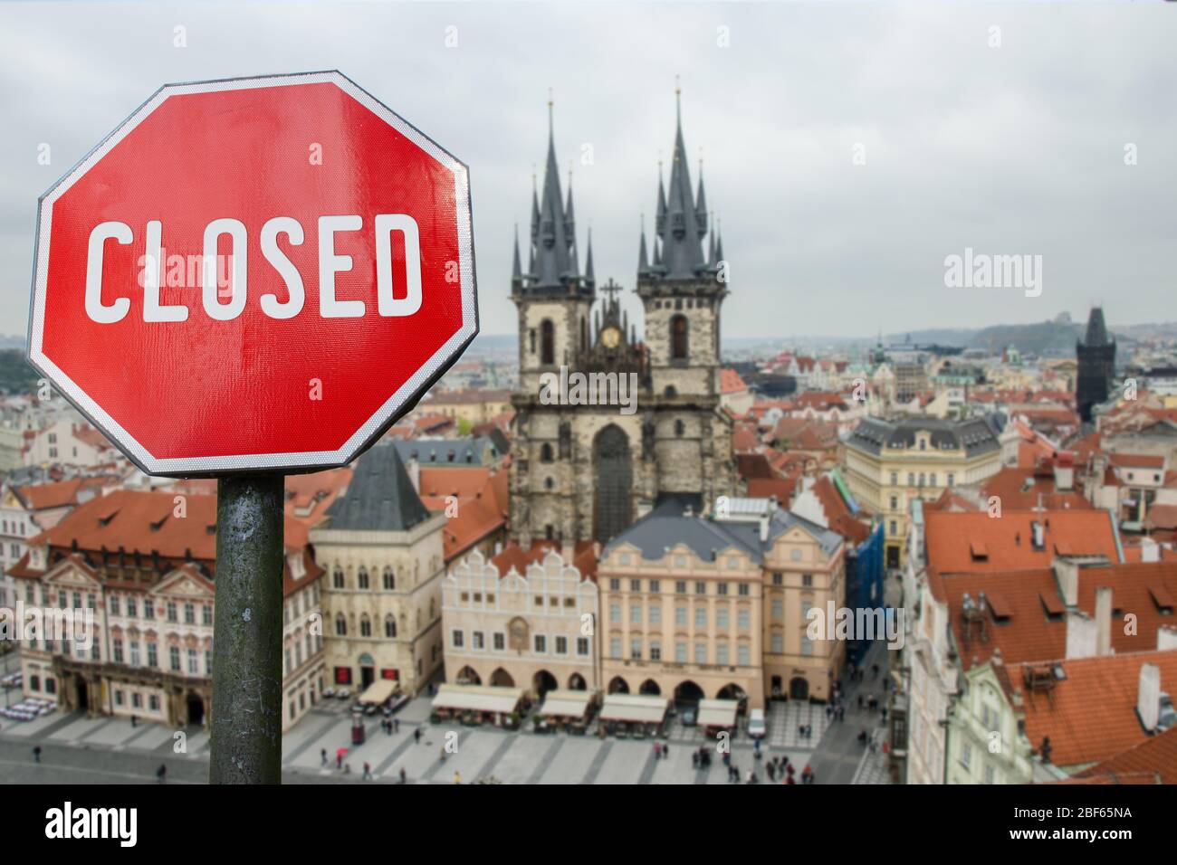 Closed, close stop sign with view of Prague, Czech. Closed facilities because of corona virus. COVID-19 pandemic quarantine. Stock Photo